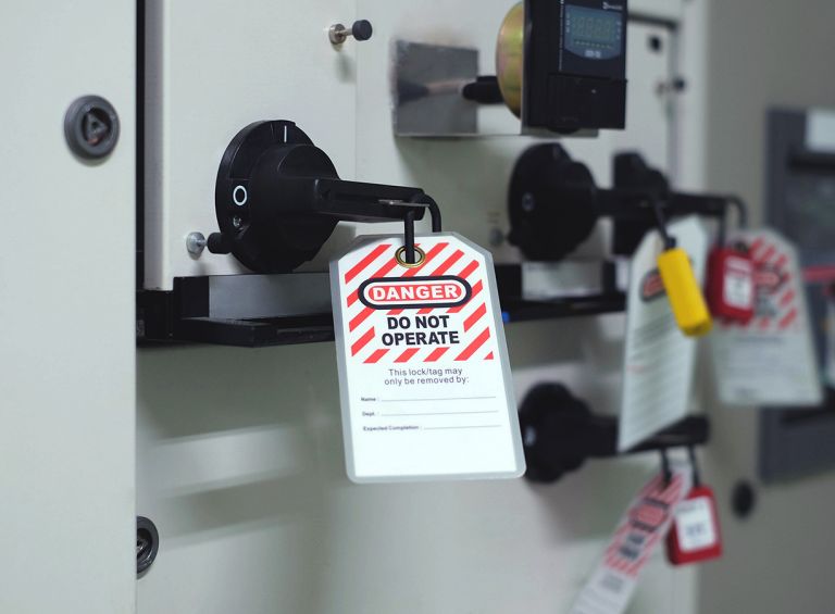 Key labeled Danger on manufacturing equipment