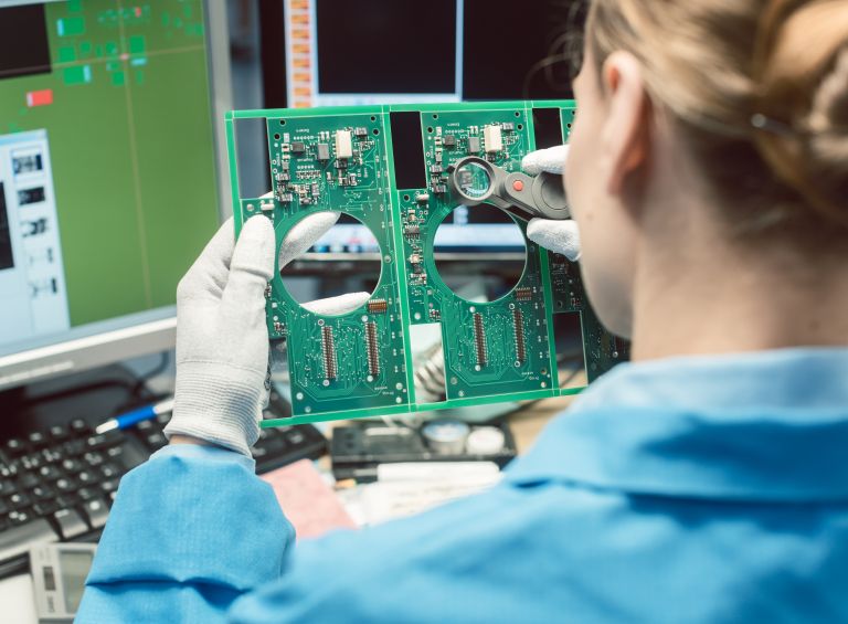 Inspector reviewing a PCB Assembly